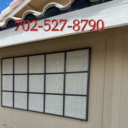 Window Screens 4 Less - 3/4 Stand-off Bronze frame with 80% UV Block Desert Sand screens. Grid pattern on the front of the house windows.