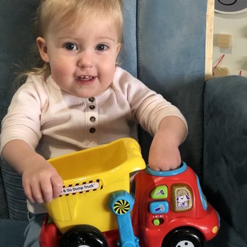 Under The Magic Pine Tree - Fun with trucks in our infant toddler room. - Child Care & Day Care Near Me - Gardnerville, Nevada