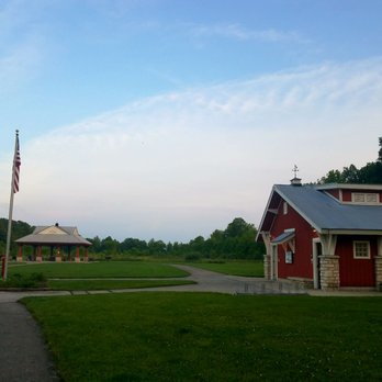 Glacier Ridge Metro Park - By the parking lot, the covered sitting area, with picknick tables. The restrooms are located in the red building on the foreground. - Parks Near Me - Plain City, Ohio