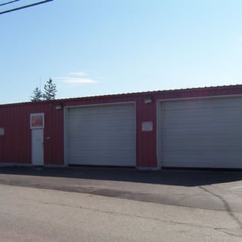 Yard Service Landscape Experts - a red building with two garages - Landscaping Near Me - East Greenwich, Rhode Island Yard Service Landscape Experts - a red building with two garages - Landscaping Near Me - East Greenwich, Rhode Island