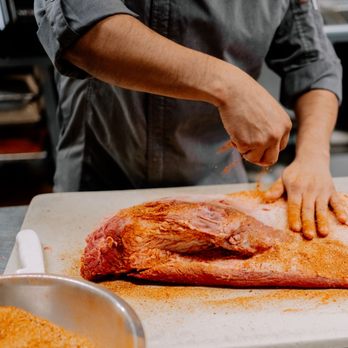 Bobbique - a chef preparing a piece of meat on a cutting board - Barbeque Near Me - Patchogue, New York