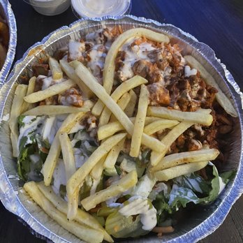 New York Eats - HELL'S KITCHEN PLATTER: Gyro Meat, Chicken, & Falafel with seasoned rice and made Extra Spicy. Topped with Fries, & white sauce . - Mediterranean Near Me - Arlington, Texas New York Eats - HELL'S KITCHEN PLATTER: Gyro Meat, Chicken, & Falafel with seasoned rice and made Extra Spicy. Topped with Fries, & white sauce . - Mediterranean Near Me - Arlington, Texas