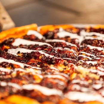 Pizza Inn - a close up of a pizza with toppings - Pizza Near Me - Midlothian, Texas