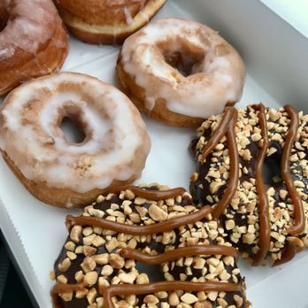 Chesapeake Doughnut Company - Premium snicker donut on the right, cake in the middle, regular glazed far left. - Donuts Near Me - White Stone, Virginia Chesapeake Doughnut Company - Premium snicker donut on the right, cake in the middle, regular glazed far left. - Donuts Near Me - White Stone, Virginia