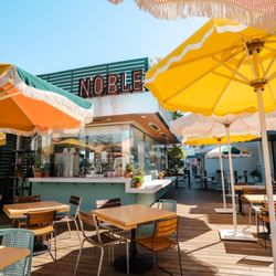 Noble Rotisserie - We've moved! Find us in the pavilion at 2nd & PCH with open‑air seating, a brighter layout, and all your favorite Noble flavors.