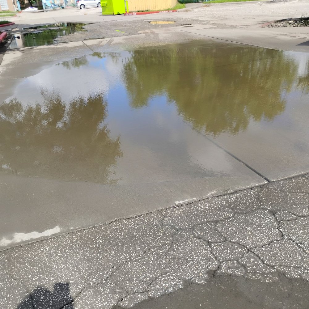 Gatesco - Flooded parking lot - Property Management Near Me - Rosenberg, Texas Gatesco - Flooded parking lot - Property Management Near Me - Rosenberg, Texas