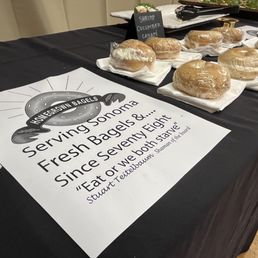 "Serving Sonoma Fresh Bagels &.... Since Seventy Eight." the sign says with bagels in the background.