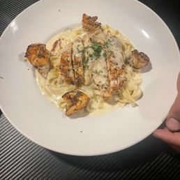 Chicken fettuccine Alfredo. ( with shrimp added) Shrimp charred to perfection and very flavorful. Alfredo was very rich. Chicken fettuccine Alfredo. ( with shrimp added) Shrimp charred to perfection and very flavorful. Alfredo was very rich.