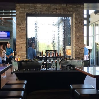 Topgolf - Lounge on main level looking towards entrance. - New American Near Me - Austin, Texas Topgolf - Lounge on main level looking towards entrance. - New American Near Me - Austin, Texas