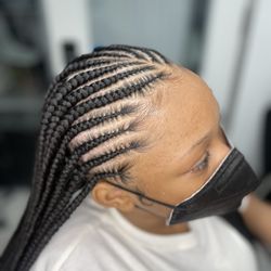 The Shanty Effect - Tribal Braids. This Style is complete with Knotless braids in the back and feed in Cornrows in the front