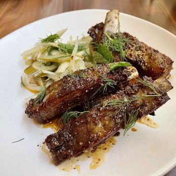 Aventino Cucina - Agnello - Porchetta-Spiced Lamb Ribs, Soft Herbs, Wildflower Honey Vinegar, Pickled Fennel - Italian Near Me - Bethesda, Maryland Aventino Cucina - Agnello - Porchetta-Spiced Lamb Ribs, Soft Herbs, Wildflower Honey Vinegar, Pickled Fennel - Italian Near Me - Bethesda, Maryland