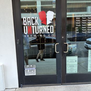 Back Unturned Brewing - Front door with business hour - Brewpubs Near Me - San Antonio, Texas