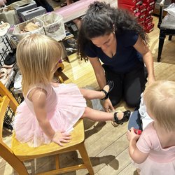 On Pointe Dancewear and More - 3-year old getting fitted for her first pair of tap shoes