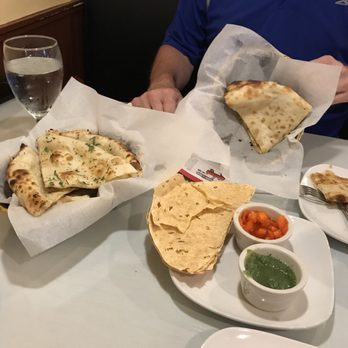 India Oven - From left to right; garlic naan, papadums with mint sauce and onion chutney, and peshwari naan. - Indian Near Me - Bowling Green, Kentucky India Oven - From left to right; garlic naan, papadums with mint sauce and onion chutney, and peshwari naan. - Indian Near Me - Bowling Green, Kentucky
