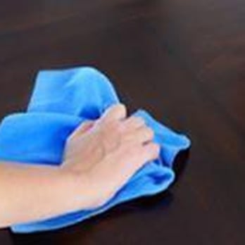 AAA Floor Refinishing - a person cleaning a table - Flooring Near Me AAA Floor Refinishing - a person cleaning a table - Flooring Near Me