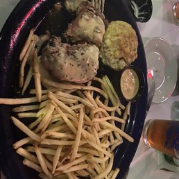 Steak and crab cake with shoestring French fries Steak and crab cake with shoestring French fries
