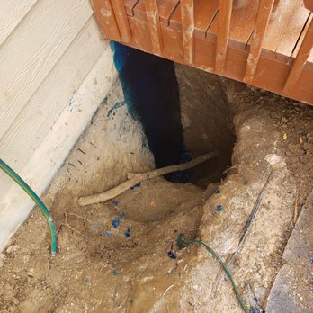 Colorado Underground Detection - The hole I dug under the deck to the footer of the foundation and sealed based on "The Leak Detective's" incorrect diagnosis. - Plumbing Near Me - Golden, Colorado