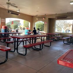 Petes Fish & Chips - Ample outdoor seating with space heaters above.