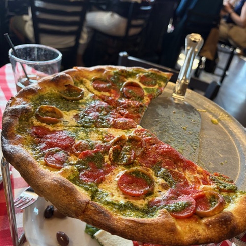 Grimaldi's Pizzeria - The duo- pesto and tomato sauce, pepp and sausage. Dove in before the picture :) - Pizza Near Me - Gilbert, Arizona Grimaldi's Pizzeria - The duo- pesto and tomato sauce, pepp and sausage. Dove in before the picture :) - Pizza Near Me - Gilbert, Arizona