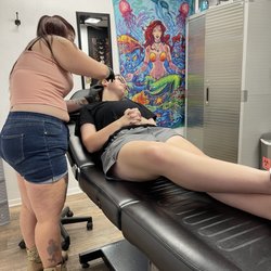 Voodoo Lounge Tattoos and Piercings - Piercing her ears