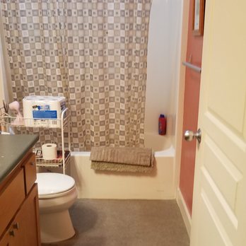 Fitting Your Home - a bathroom with a shower, toilet and sink - General Contractors Near Me Fitting Your Home - a bathroom with a shower, toilet and sink - General Contractors Near Me
