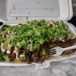 Little Puerto Rico - Two hefty sized potatoes with pork shoulder (pernil), bacon, broccoli, cheese and sour cream.