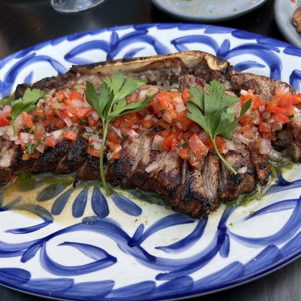 La Bodega - Bone in New York strip - Spanish Near Me - Watertown, Massachusetts La Bodega - Bone in New York strip - Spanish Near Me - Watertown, Massachusetts