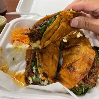 Tacotlan - 3 beef birria taco dinner. Included is rice and beans and some dipping sauce. - Mexican Near Me - Chicago, Illinois Tacotlan - 3 beef birria taco dinner. Included is rice and beans and some dipping sauce. - Mexican Near Me - Chicago, Illinois