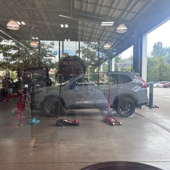 Discount Tire - Car being serviced for a flat tire - Tires Near Me - Bothell, Washington