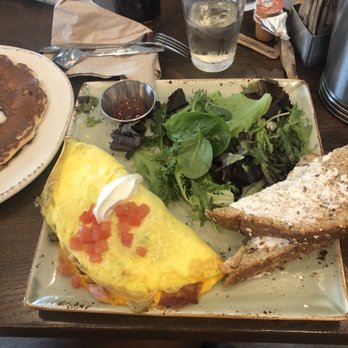 First Watch - The works omelette. Some unnecessary lettuce and some wonderful multi grain toast.I think that's jelly in the little dish. - Breakfast & Brunch Near Me - Grand Prairie, Texas First Watch - The works omelette. Some unnecessary lettuce and some wonderful multi grain toast.I think that's jelly in the little dish. - Breakfast & Brunch Near Me - Grand Prairie, Texas