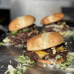 SHMASH’D Burgers - Incredible burgs. The authentic "Hella Jalapeño" burger seen on the left.