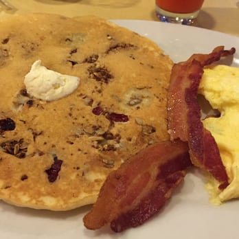 First Watch - Trifecta-banana granola pancake, bacon and scrambled eggs - Breakfast & Brunch Near Me - Longwood, Florida