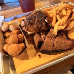 Two meat platte, beef brisket, smoke chicken, fries, corn nuggets and Texas toast.
