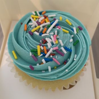 Happycakes - a cupcake with blue frosting and sprinkles - Desserts Near Me - Surrey, British Columbia Happycakes - a cupcake with blue frosting and sprinkles - Desserts Near Me - Surrey, British Columbia