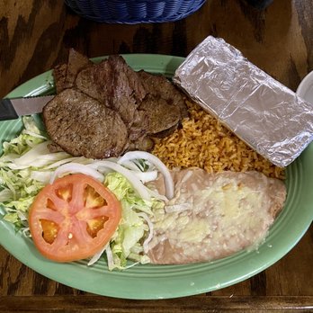 El Mexico - a plate of food with meat, rice, tomatoes, and a salad - Mexican Near Me - Shelbyville, Tennessee El Mexico - a plate of food with meat, rice, tomatoes, and a salad - Mexican Near Me - Shelbyville, Tennessee