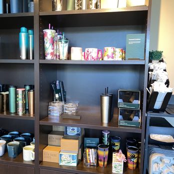 Starbucks - a shelf of coffee cups, mugs, and other items - Coffee & Tea Near Me - Miami, Florida Starbucks - a shelf of coffee cups, mugs, and other items - Coffee & Tea Near Me - Miami, Florida