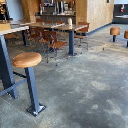 Chipotle Mexican Grill - Zoom in. See the dirty tables, food and spills on floor, and overflowing trash by the drink machine.