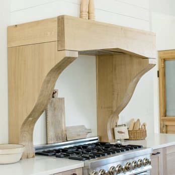 Camdon Construction - a kitchen with a stove and a wooden shelf - General Contractors Near Me - St Charles, Missouri Camdon Construction - a kitchen with a stove and a wooden shelf - General Contractors Near Me - St Charles, Missouri