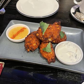 The Peached Tortilla - 2025 Special Grinch Menu Item: Corn Fritters - Asian Fusion Near Me - Cedar Park, Texas The Peached Tortilla - 2025 Special Grinch Menu Item: Corn Fritters - Asian Fusion Near Me - Cedar Park, Texas