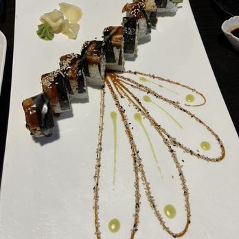 Victoria Sushi - a long piece of sushi on a white plate - Sushi Bars Near Me - Victoria, British Columbia Victoria Sushi - a long piece of sushi on a white plate - Sushi Bars Near Me - Victoria, British Columbia