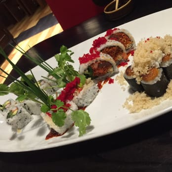 Kizuna - right to left: dyno-mite, inferno roll (including the two with chives/cilantro sticking out), California, green tobiko nigiri. - Sushi Bars Near Me - Vienna, Virginia Kizuna - right to left: dyno-mite, inferno roll (including the two with chives/cilantro sticking out), California, green tobiko nigiri. - Sushi Bars Near Me - Vienna, Virginia