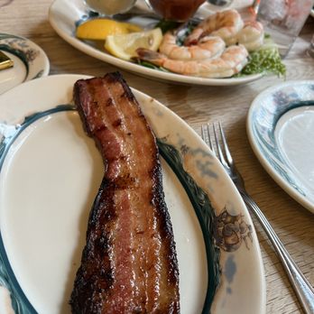 Peter Luger - Luger's Sizzling Bacon, Extra Thick by the Slice and Jumbo Shrimp Cocktail - Steakhouses Near Me - Brooklyn, New York Peter Luger - Luger's Sizzling Bacon, Extra Thick by the Slice and Jumbo Shrimp Cocktail - Steakhouses Near Me - Brooklyn, New York