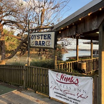 Tunk's Cypress Inn - Sign that indicates oyster bar downstairs! This seemed to be the place to be since it was always busy - Seafood Near Me - Boyce, Louisiana