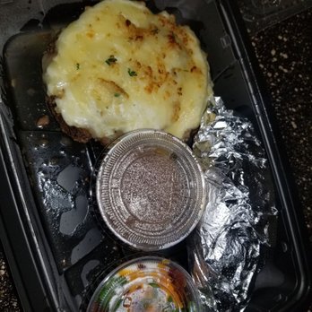 LongHorn Steakhouse - Chopped Steak with Parmesan Cheese topping with Loaded Baked Potato (Brown gravy, sauteed onions and mushrooms not pictured) - Steakhouses Near Me - Round Rock, Texas