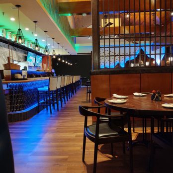 Akomeya - a view of a dining room with a bar in the background - Asian Fusion Near Me - Bluffton, South Carolina Akomeya - a view of a dining room with a bar in the background - Asian Fusion Near Me - Bluffton, South Carolina