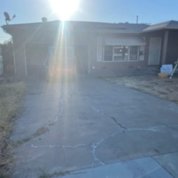 Supreme Concrete Group - Cracks in driveway with CAT in garage - Masonry/Concrete Near Me
