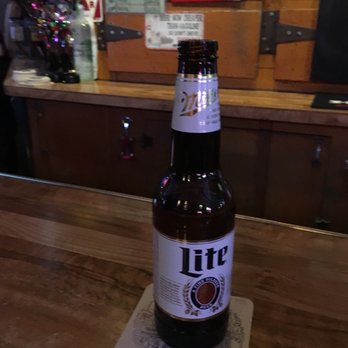 Trail Too - a bottle of lite sitting on a coaster - Karaoke Near Me - Hemet, California