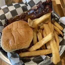 Pulled pork sandwich, rib, and fries