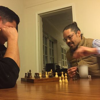 Bunk+Brew Historic Lucas House - Guests enjoying chess - Hostels Near Me - Bend, Oregon Bunk+Brew Historic Lucas House - Guests enjoying chess - Hostels Near Me - Bend, Oregon