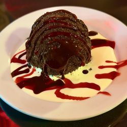 Little Bear Inn - Bear Balls for dessert! Rich ice cream, rolled in Oreo crumbles, drizzled with chocolate syrup in a bed of cream & raspberry: WOW!